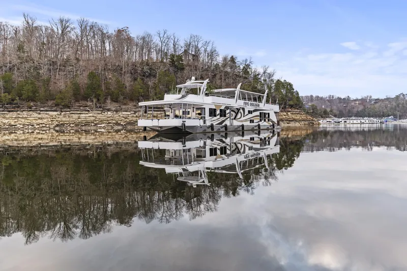Slide: The Image of Houseboat on calm lake with forested shoreline, Sharpe 20 x 100, 2009 model. - 39