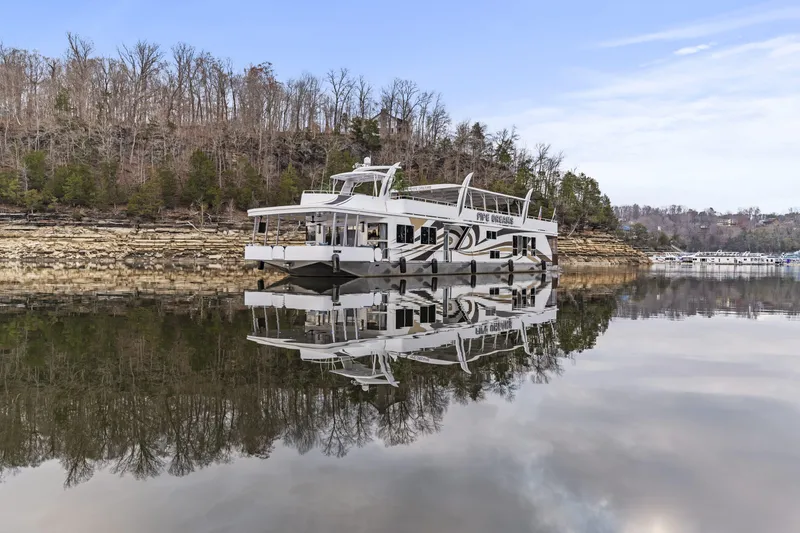 Slide: The Image of Luxurious 2009 Sharpe 20 x 100 houseboat on a serene lake with forested shoreline. - 40