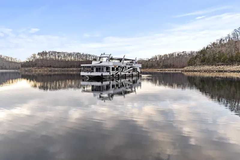 Slide: The Image of Houseboat on calm lake with reflection, surrounded by trees; Sharpe 20 x 100, 2009 model. - 43