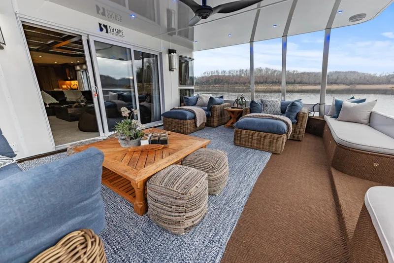 Slide: The Image of Luxurious 2009 Sharpe houseboat interior with cozy seating and river view. - 6
