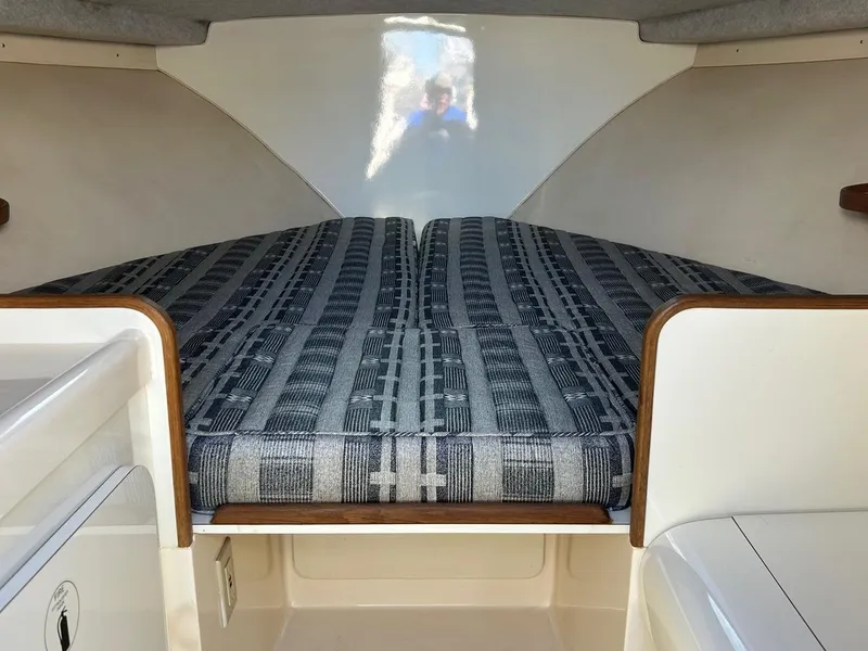 Slide: The Image of Interior cabin of 1988 Bertram 28 Moppie with patterned bedding. - 17