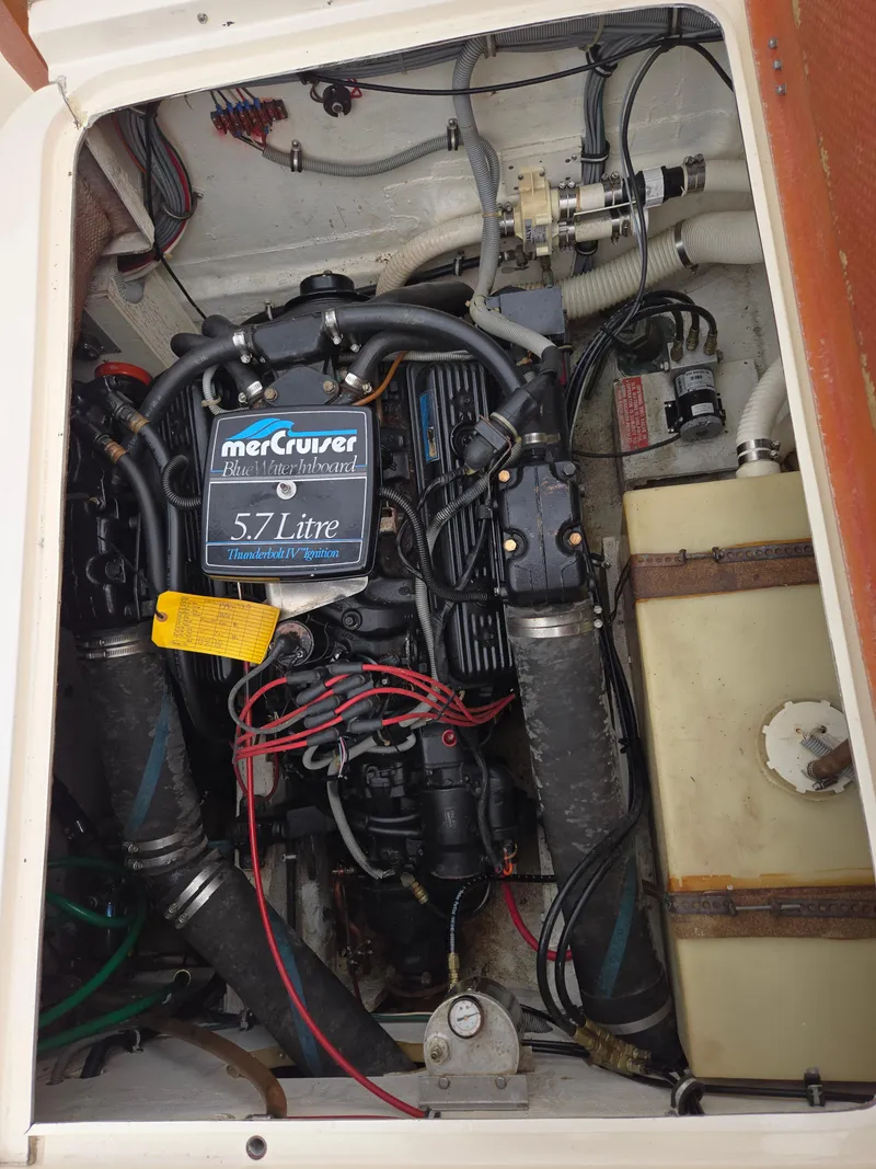 Slide: The Image of Engine compartment of a 1988 Bertram 28 Moppie with MerCruiser 5.7L engine. - 35