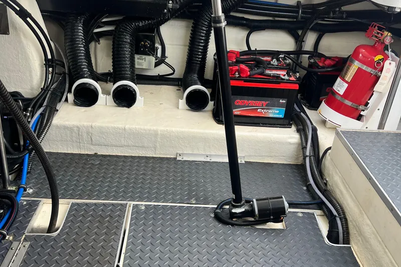 Slide: The Image of Engine room of 2023 Formula 330 CBR with battery and fire extinguisher. - 13