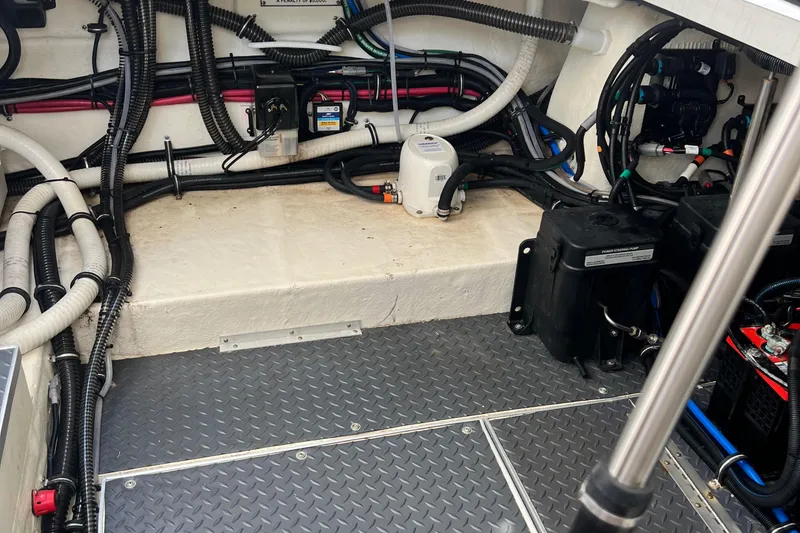 Slide: The Image of Engine compartment of 2023 Formula 330 CBR boat with wiring and battery systems. - 14