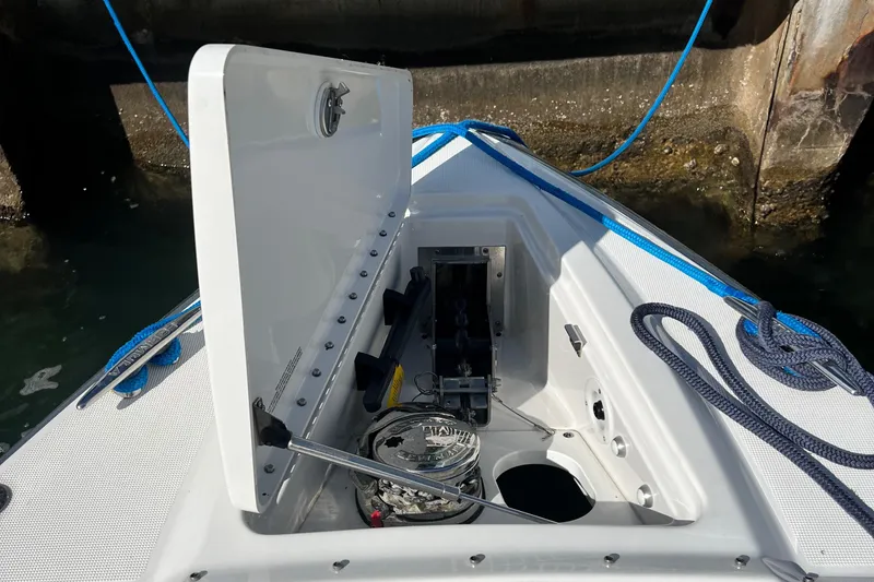 Slide: The Image of Open storage compartment on 2023 Formula 330 CBR boat with ropes and equipment. - 15