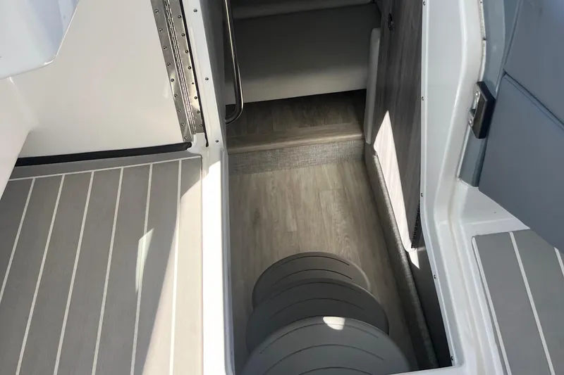 Slide: The Image of 2023 Formula 330 CBR boat interior with sleek flooring and modern design. - 16