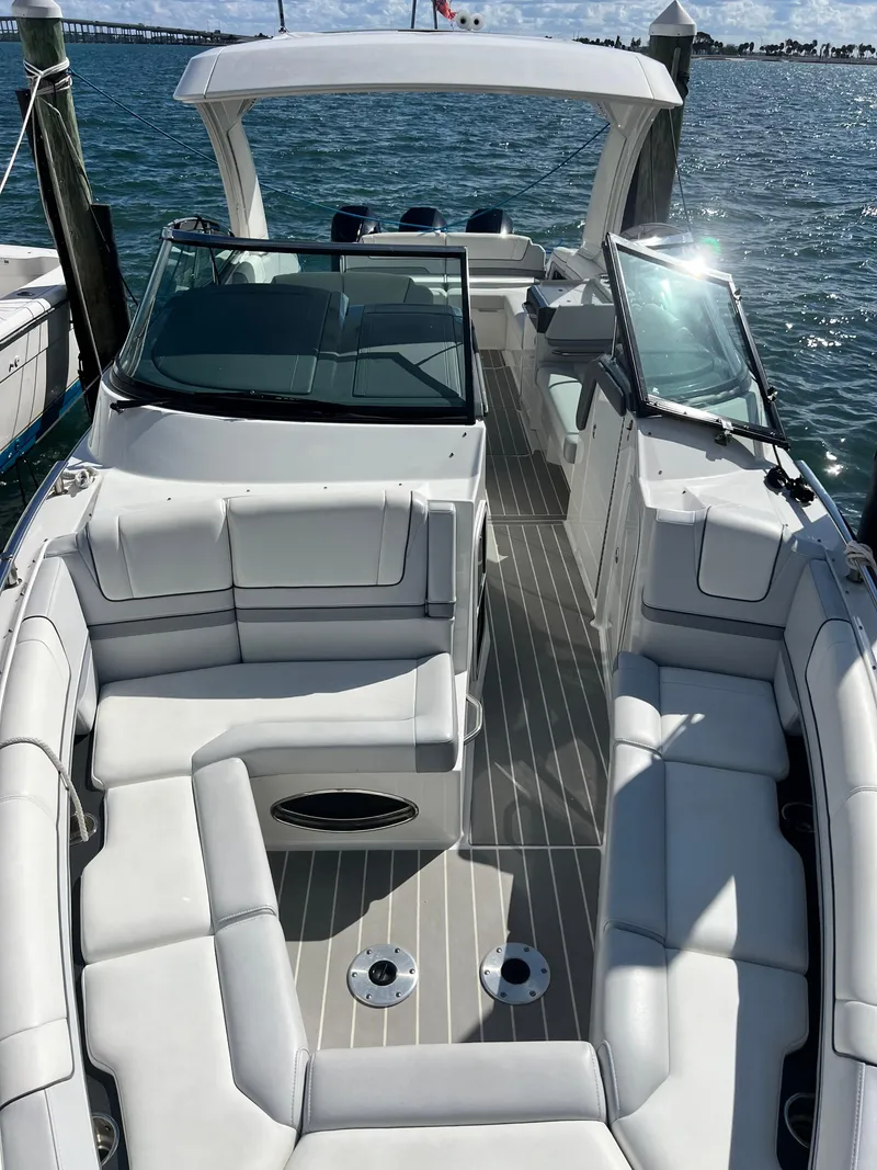 Slide: The Image of 2023 Formula 330 CBR boat with spacious seating and sleek design on the water. - 3