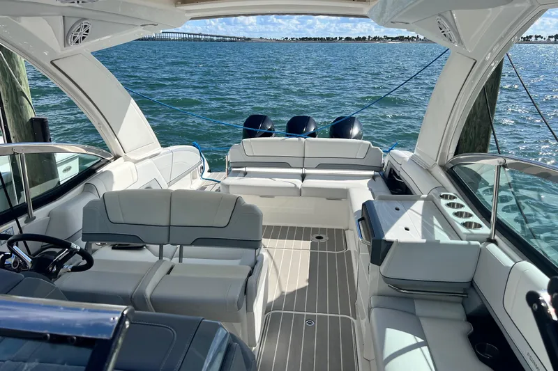 Slide: The Image of 2023 Formula 330 CBR luxury boat interior with spacious seating on open water. - 5