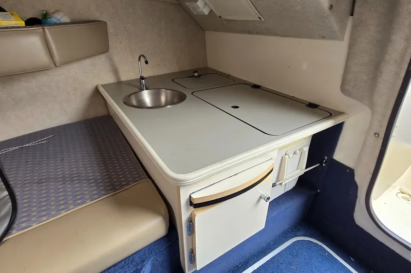 Slide: The Image of 2001 Bayliner 23 Capri cabin interior with kitchenette and sink. - 5