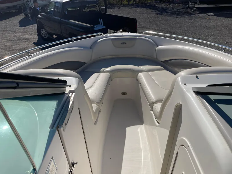 Slide: The Image of 2007 Chaparral 256 SSi boat interior with white seating and open deck. - 13