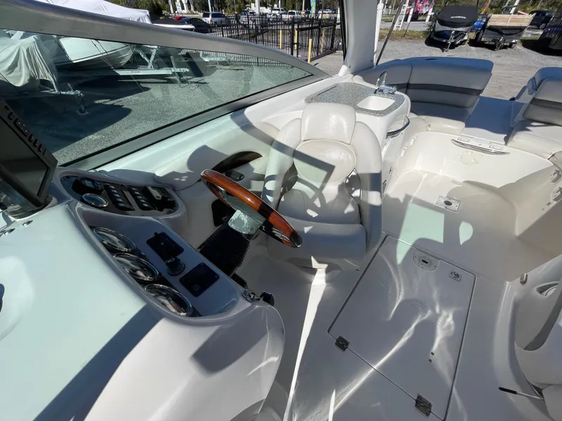 Slide: The Image of 2007 Chaparral 256 SSi boat interior with steering wheel and seating area. - 16