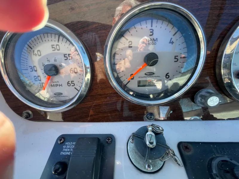 Slide: The Image of Close-up of 2007 Chaparral 256 SSi boat dashboard gauges and ignition keys. - 19