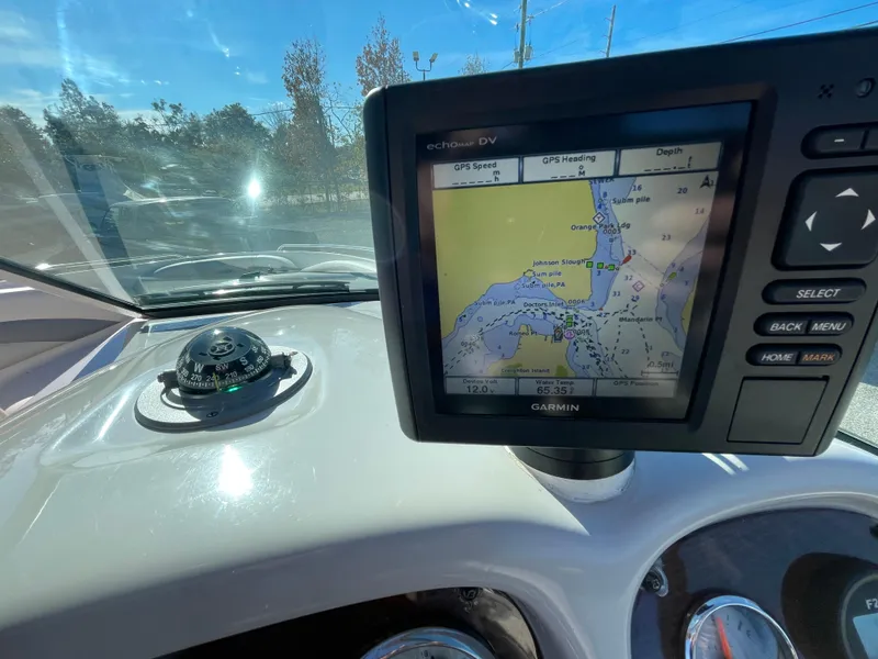 Slide: The Image of Garmin GPS on 2007 Chaparral 256 SSi boat dashboard, showing navigation map. - 20