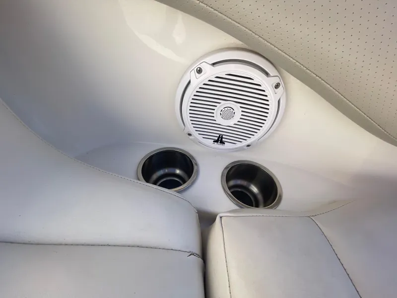 Slide: The Image of 2007 Chaparral 256 SSi boat interior with speaker and cup holders. - 23