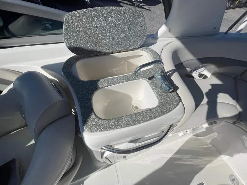 Slide: The Image of 2007 Chaparral 256 SSi boat interior with dual sink and faucet. - 24