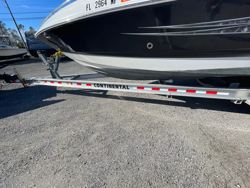 Slide: The Image of 2007 Chaparral 256 SSi boat on Continental trailer, parked on gravel. - 38