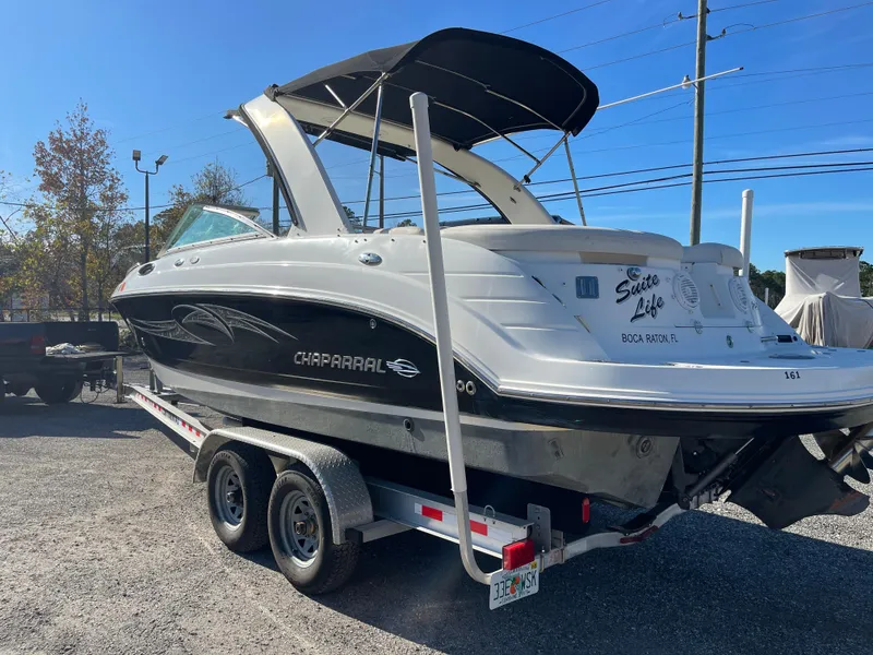 Slide: The Image of 2007 Chaparral 256 SSi boat on trailer, black and white design, outdoor setting. - 6