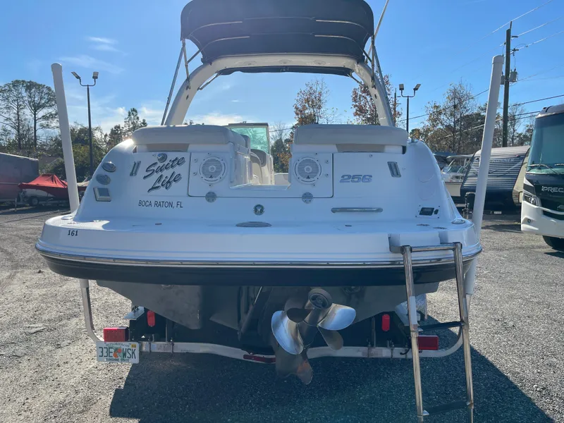 Slide: The Image of 2007 Chaparral 256 SSi boat, rear view, parked outdoors under clear sky. - 8