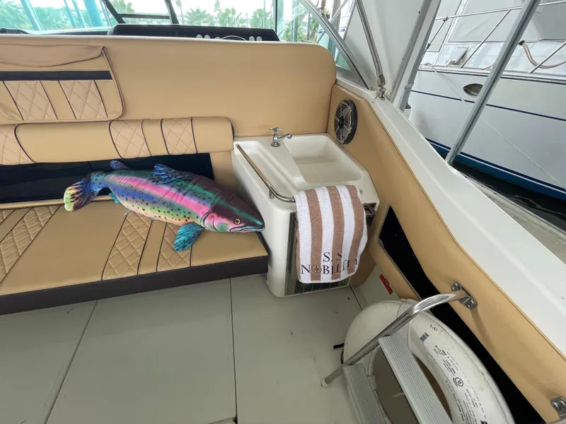 Slide: The Image of Interior view of 1993 Sea Ray 370 Sundancer boat cockpit with steering wheel and controls. - 10
