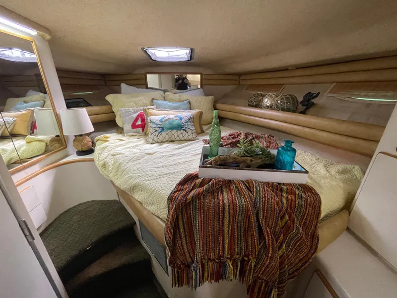 Slide: The Image of Luxurious 1993 Sea Ray 370 Sundancer cabin with plush seating and elegant decor. - 16
