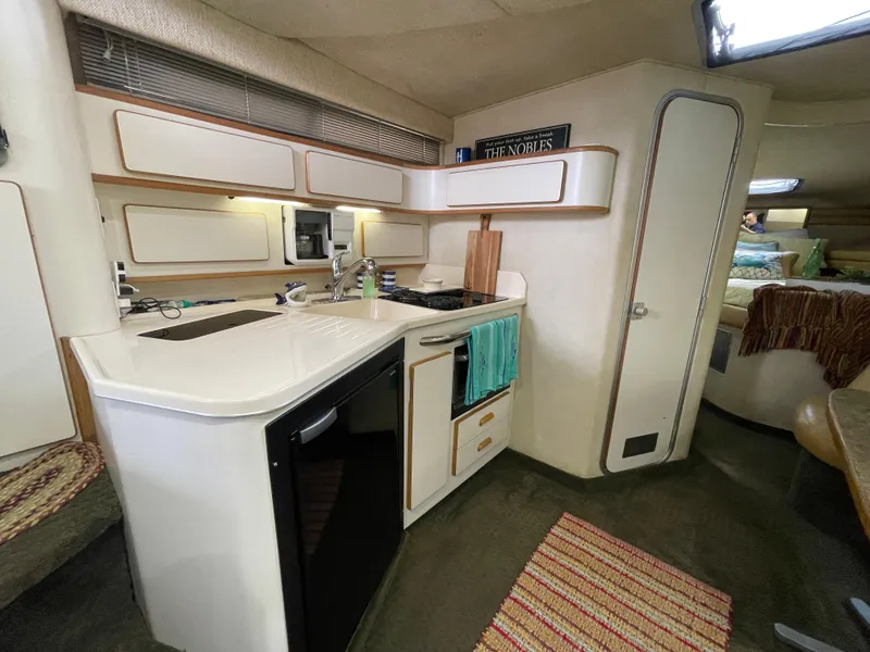 Slide: The Image of Luxurious 1993 Sea Ray 370 Sundancer cabin with cozy seating and elegant decor. - 20