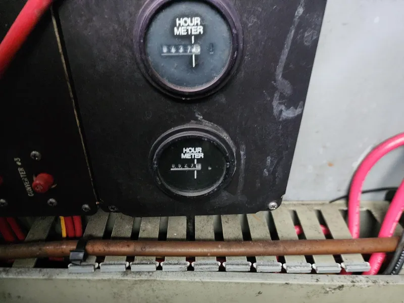 Slide: The Image of Engine compartment of 1993 Sea Ray 370 Sundancer with batteries and wiring. - 26