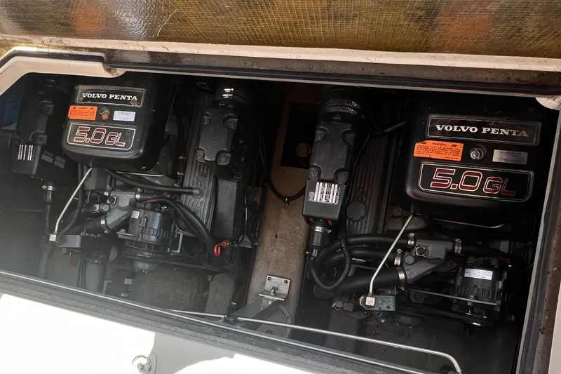 Slide: The Image of Twin Volvo Penta 5.0L engines in a 1998 Regal 292 Commodore boat. - 10