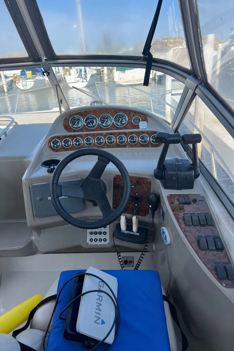 Slide: The Image of 1998 Regal 292 Commodore boat cockpit with steering wheel and instrument panel. - 5