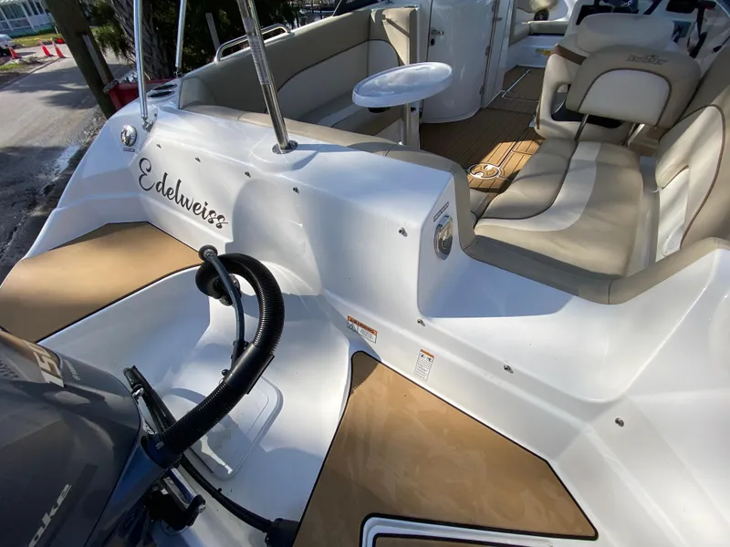 Slide: The Image of 2022 NauticStar 223 DC boat interior with seating and table. - 10
