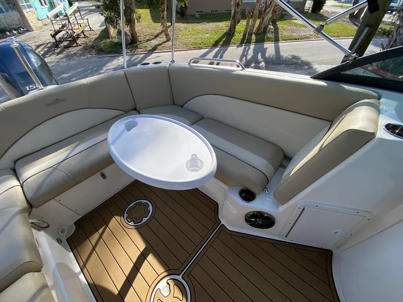 Slide: The Image of 2022 NauticStar 223 DC boat interior with seating and table. - 21
