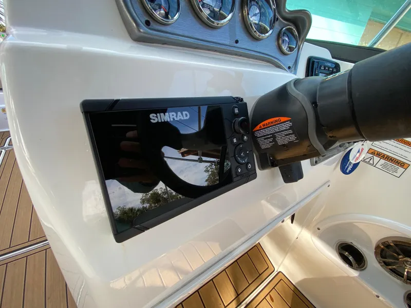 Slide: The Image of Dashboard of 2022 NauticStar 223 DC with Simrad navigation system. - 25