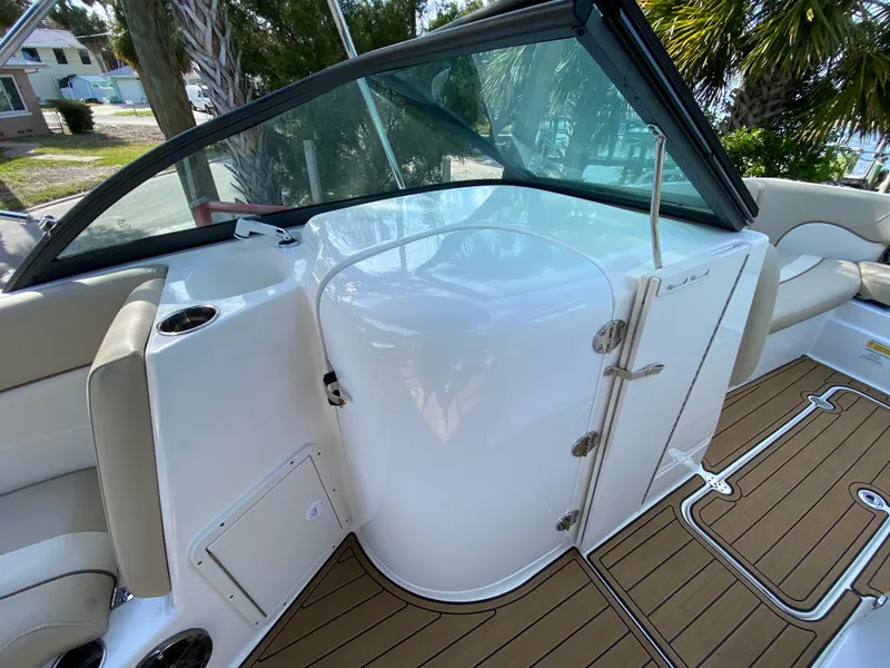 Slide: The Image of 2022 NauticStar 223 DC boat interior with sleek design and wood flooring. - 32