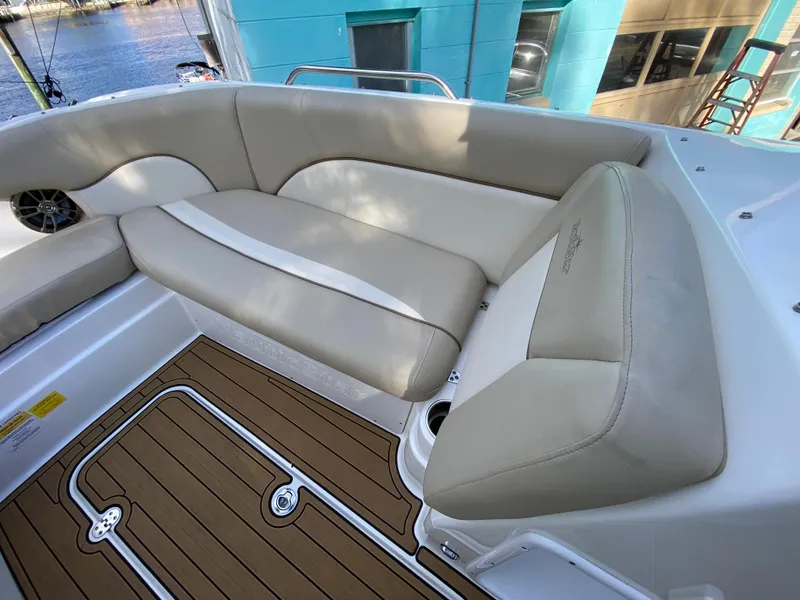 Slide: The Image of 2022 NauticStar 223 DC boat interior with beige seating and teak flooring. - 35