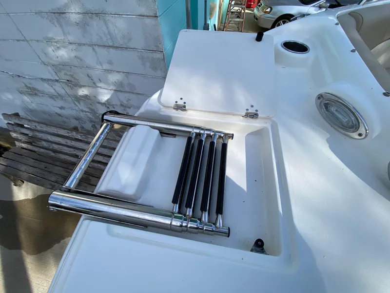 Slide: The Image of NauticStar 223 DC 2022 boat with foldable stainless steel ladder. - 41