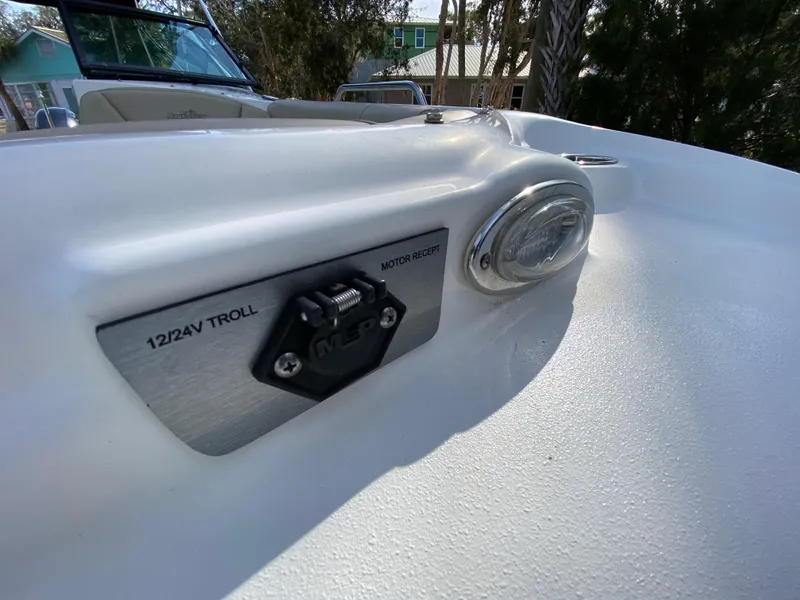 Slide: The Image of Close-up of 2022 NauticStar 223 DC boat's 12/24V trolling motor receptacle. - 43