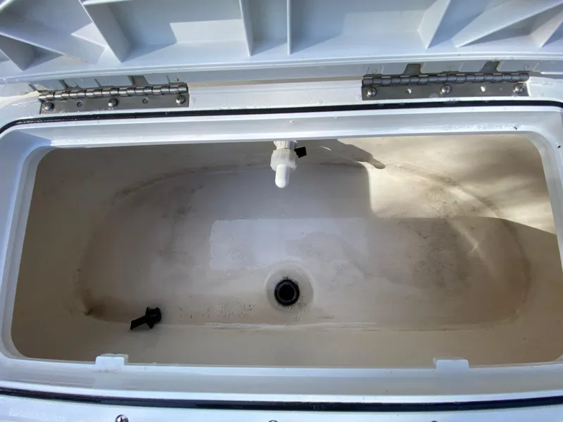Slide: The Image of Open storage compartment of 2022 NauticStar 223 DC boat. - 47