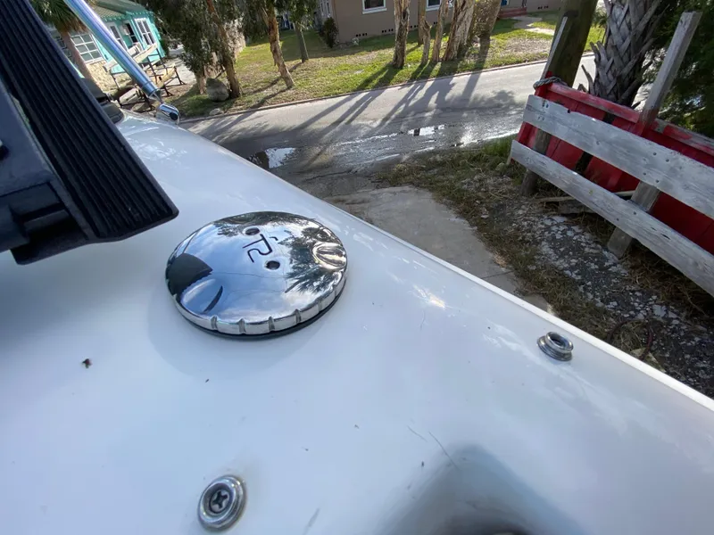 Slide: The Image of Close-up of 2022 NauticStar 223 DC boat deck with chrome fuel cap. - 49