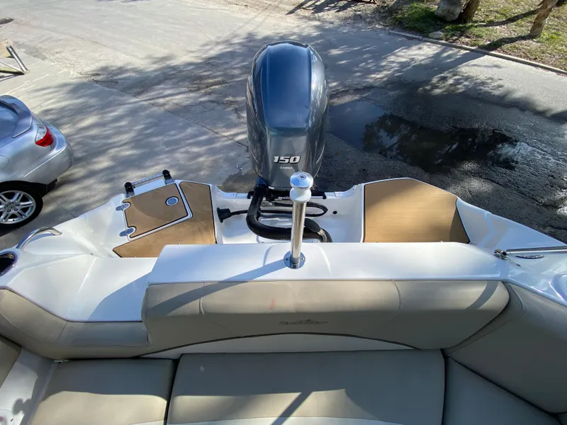 Slide: The Image of 2022 NauticStar 223 DC boat with 150 HP engine, rear seating view. - 8