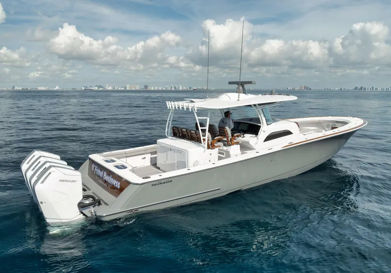 Slide: The Image of 2024 Valhalla Boatworks V-46 cruising on open water under a cloudy sky. - 1