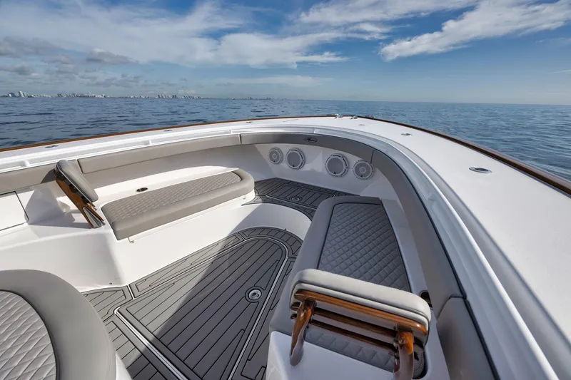 Slide: The Image of 2024 Valhalla Boatworks V-46 deck with seating, ocean view, and clear sky. - 12