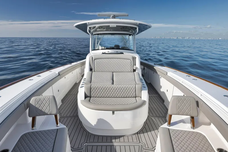 Slide: The Image of 2024 Valhalla Boatworks V-46 on open water, featuring luxurious seating and sleek design. - 14