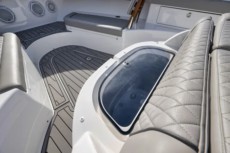 Slide: The Image of 2024 Valhalla V-46 boat interior with cushioned seating and sleek flooring. - 16