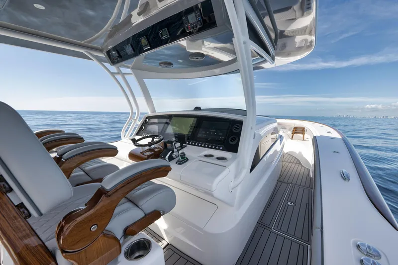 Slide: The Image of 2024 Valhalla Boatworks V-46 helm with luxurious seating and advanced navigation system. - 29