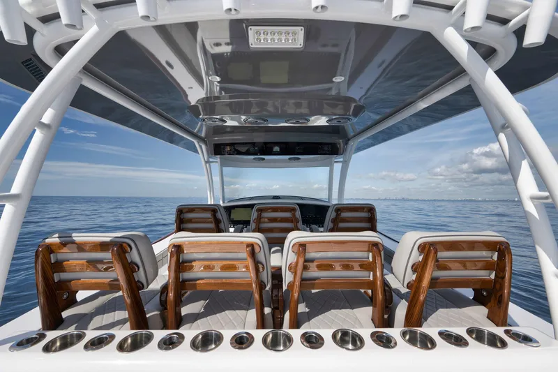 Slide: The Image of 2024 Valhalla Boatworks V-46 interior with wooden seating, ocean view, and sleek design. - 31