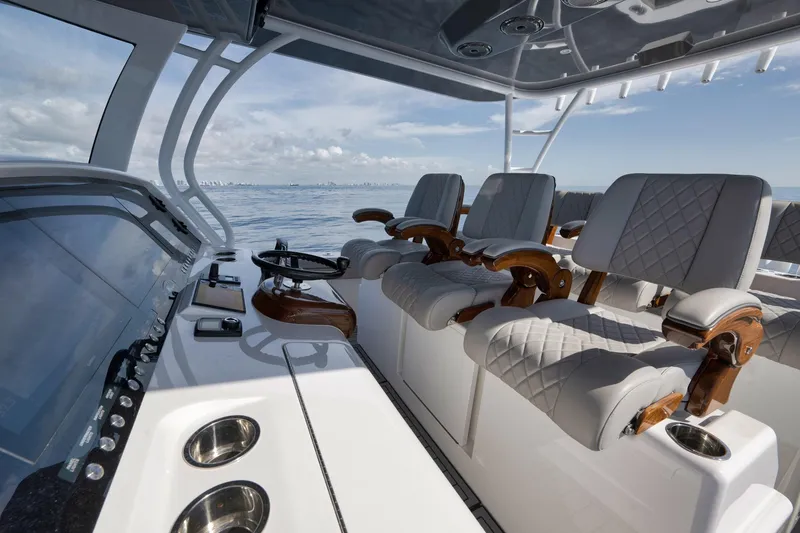 Slide: The Image of 2024 Valhalla Boatworks V-46 interior with luxurious seating and modern helm controls. - 33