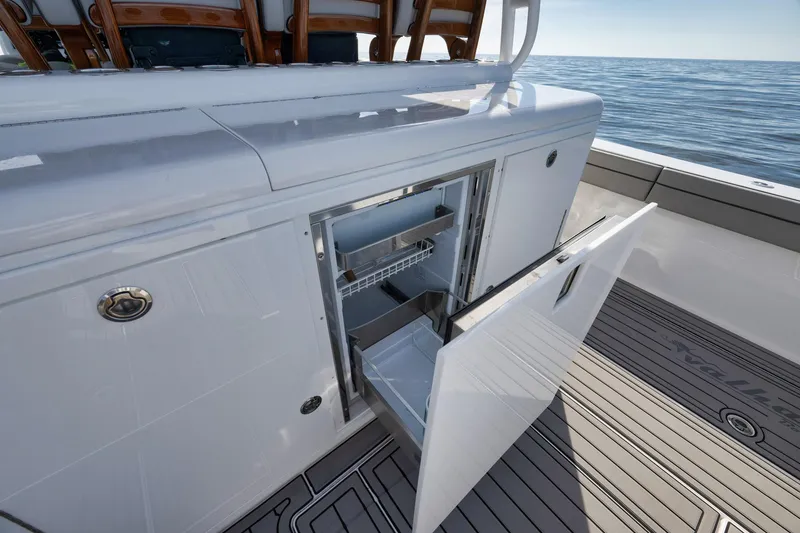 Slide: The Image of 2024 Valhalla V-46 boat with open storage compartment on deck. - 42