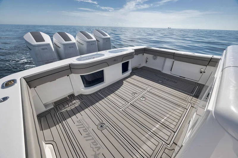 Slide: The Image of 2024 Valhalla Boatworks V-46 deck with four powerful outboard engines on open water. - 43