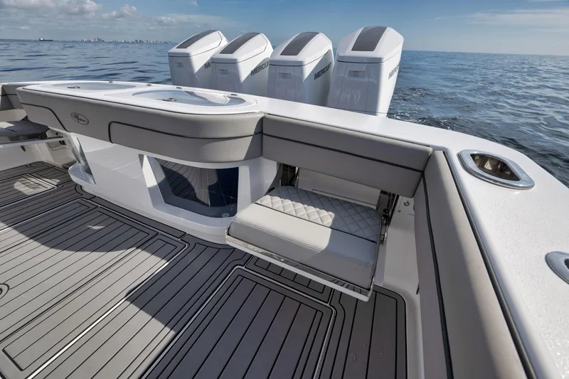 Slide: The Image of 2024 Valhalla Boatworks V-46, sleek deck design with powerful engines on open water. - 49