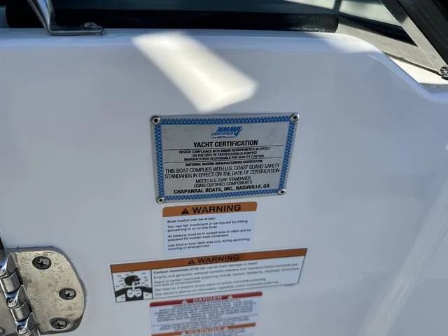 Slide: The Image of 2022 Chaparral 287 SSX yacht certification and safety warning labels. - 12