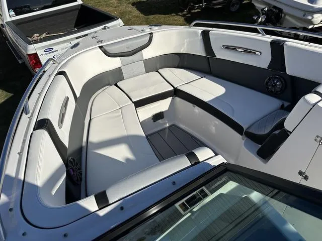 Slide: The Image of 2022 Chaparral 287 SSX boat interior with luxurious seating and modern design. - 13